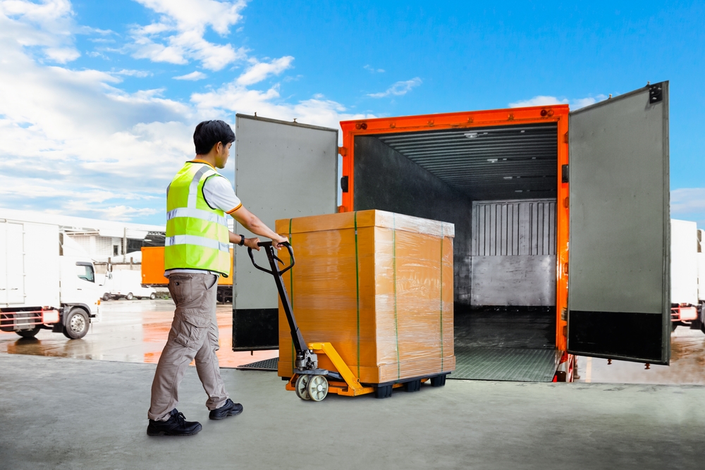 Workers,Unloading,Heavy,Pallet,Boxes,Into,Container,Truck.,Loading,Dock